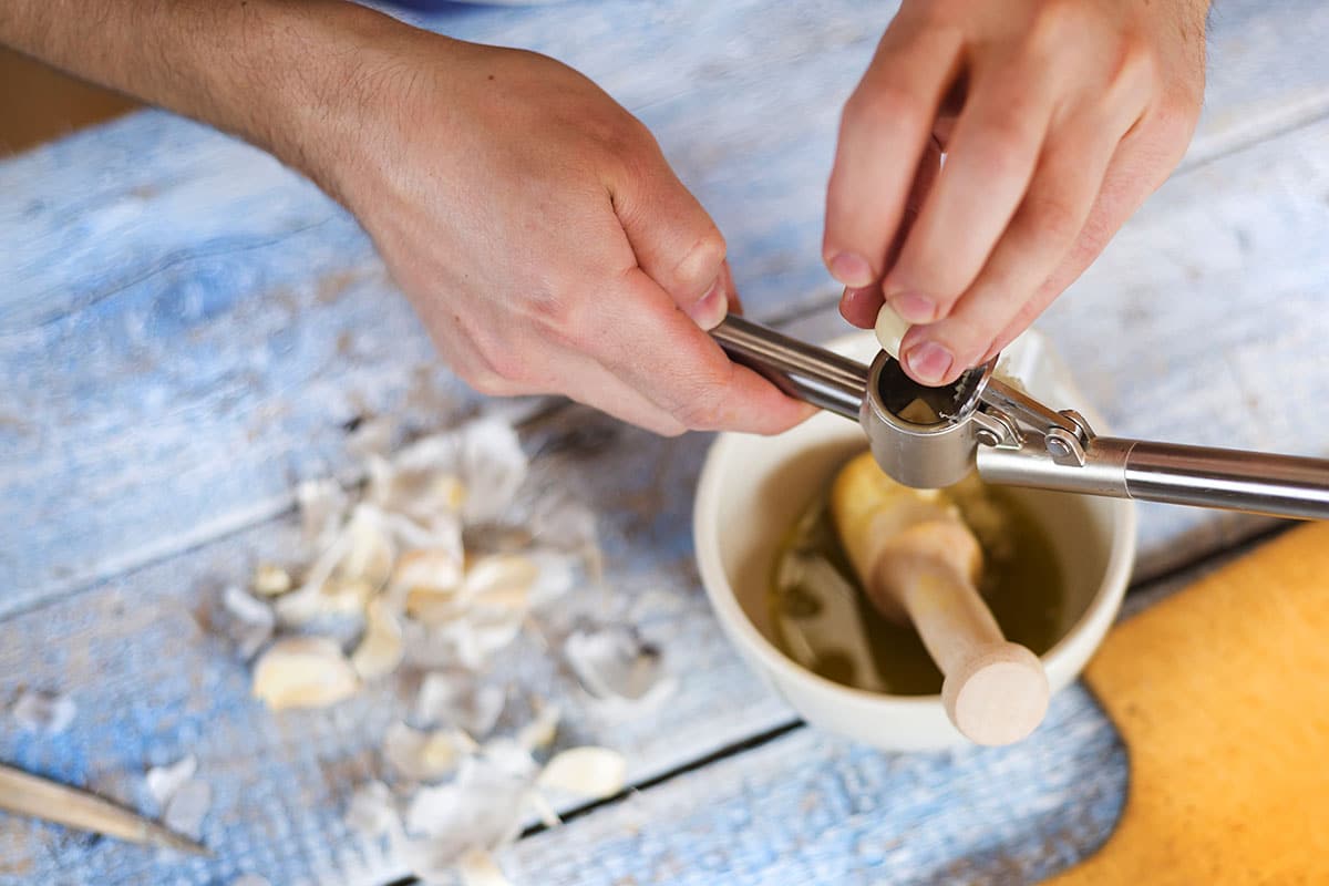 To my mind, using a garlic press is by far the easiest way of mincing garlic. Just pop the clove into the press, squeeze firmly, and its job done.