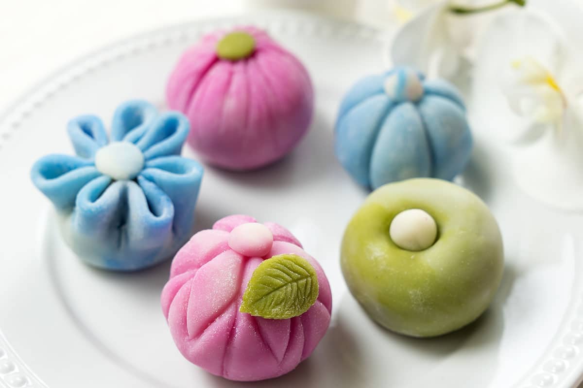 Dango is a colored dumpling dish made from sweetened rice flour and water. They are formed into bite-size balls and presented on a skewer.