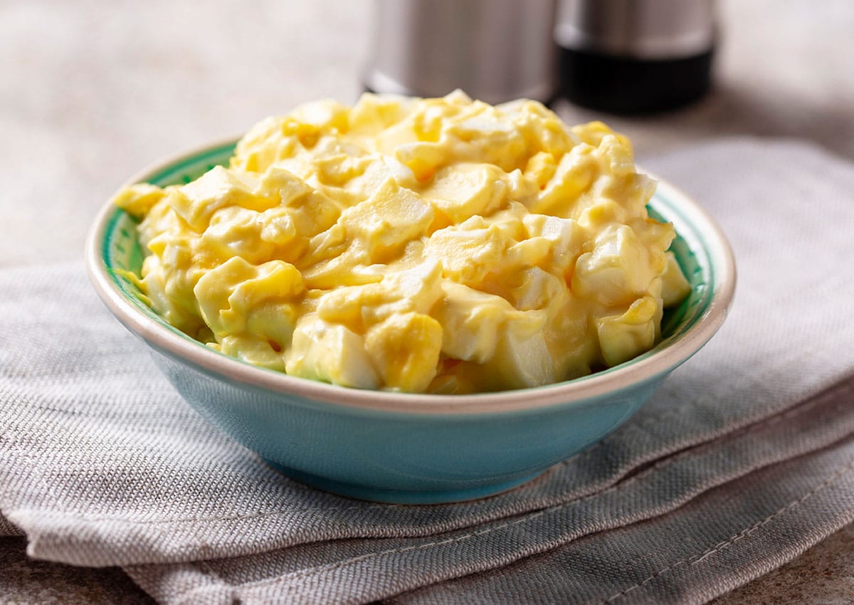 When egg salad begins to go off, the bacteria that cause it will make the salad develop a sour sulfur-like smell. In addition, the salad will discolor, and mold will begin to form. This is all fairly obvious stuff.