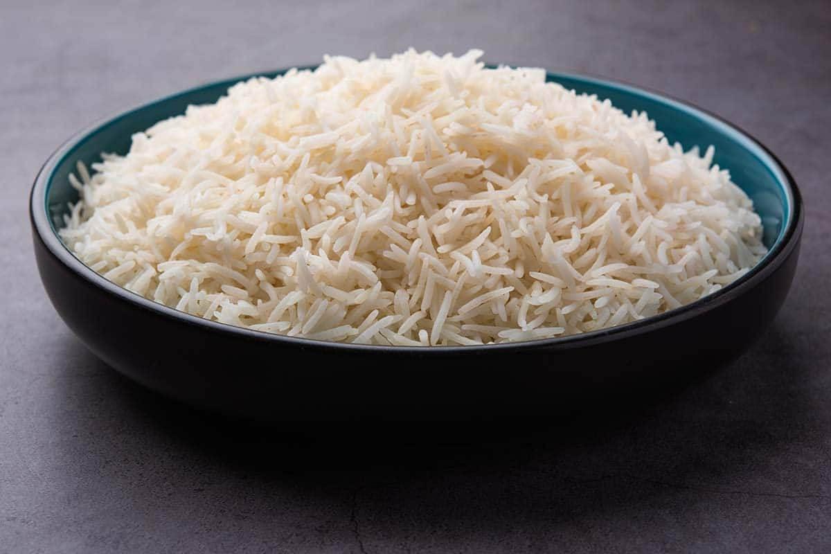 The basmati rice usually served with Indian curry has longer grains than jasmine, and when served, the grains are quite separate and not sticky.