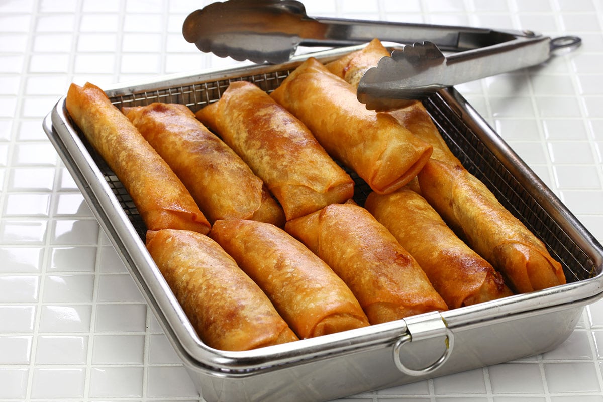 Transfer the lumpia into a colander or strainer to allow the oil to drain away. To dry them further, you can apt them gently with some paper kitchen towel.