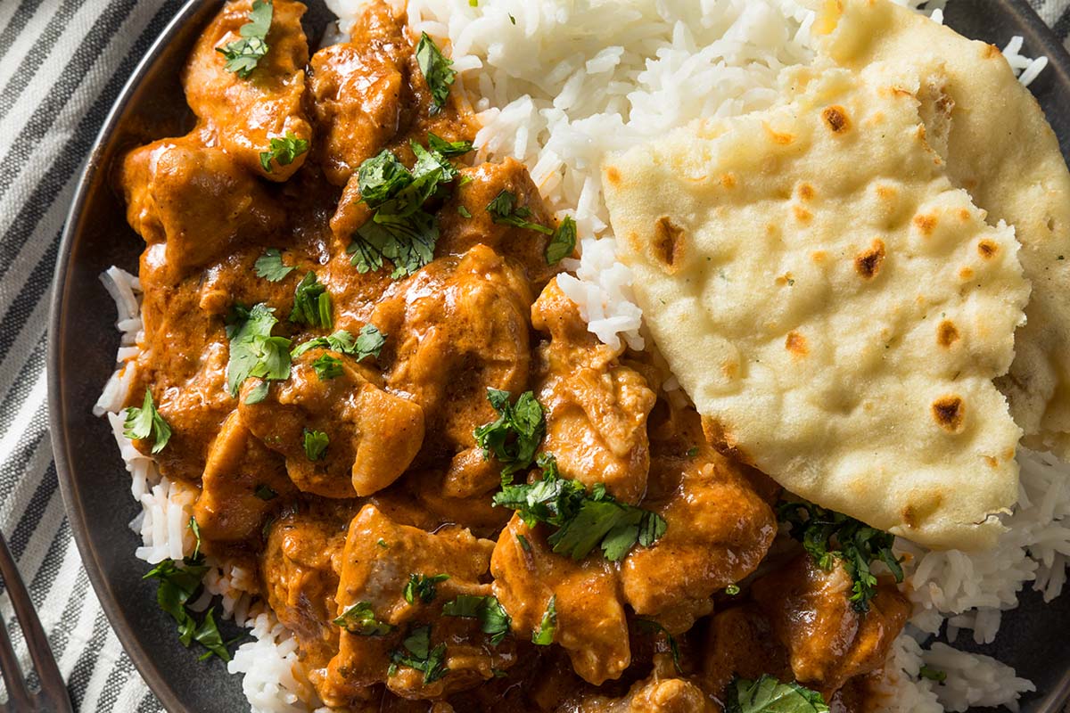 Tikka Masala usually features chicken as its main protein in a creamy tomato-based sauce. In India and Indian restaurants in the west, Tikka Masala is made with boneless chicken cooked in a tandoor.