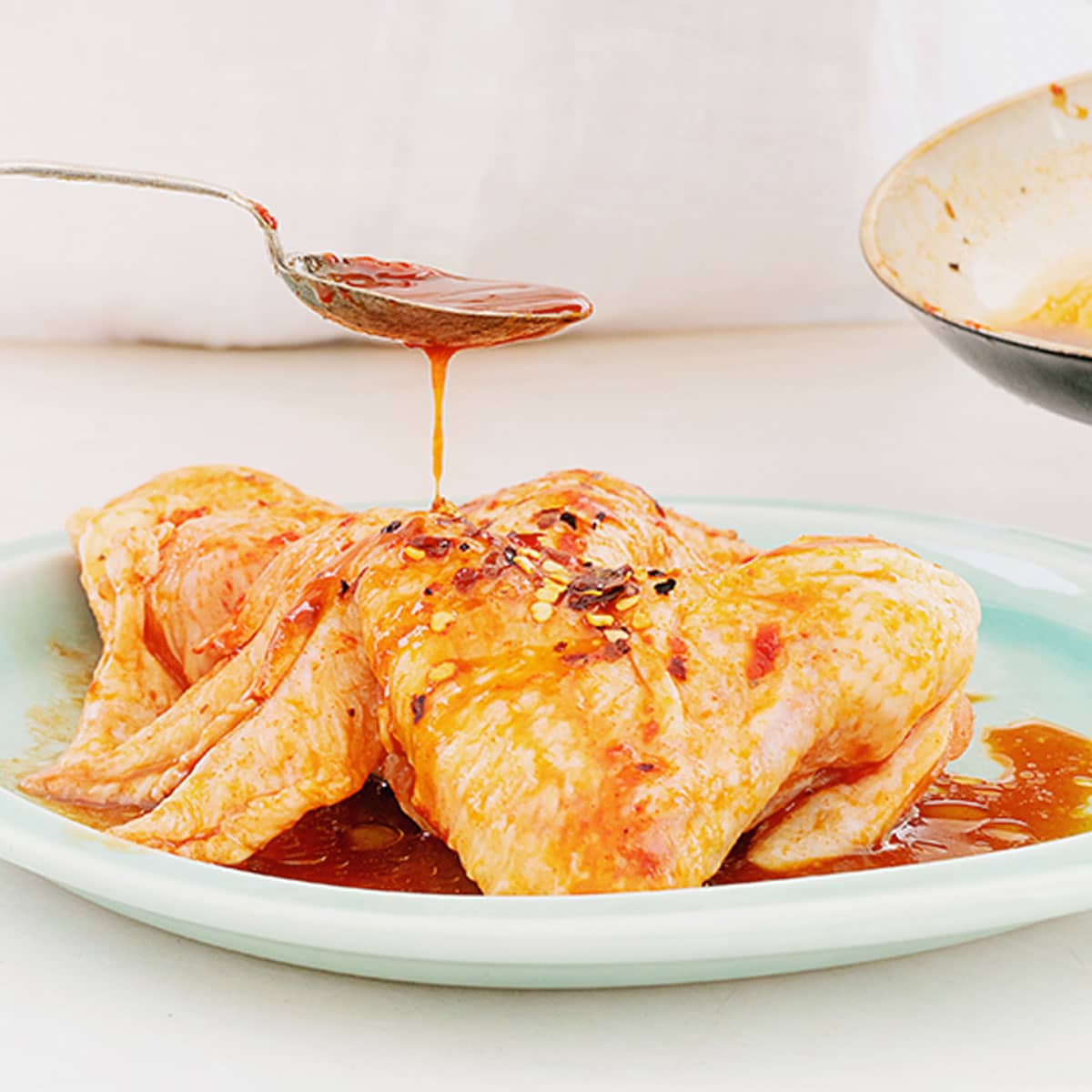 You can over-marinate chicken if you use an acidic marinade containing either citrus juices, vinegar, or wine if you leave it on the chicken for too long before cooking.