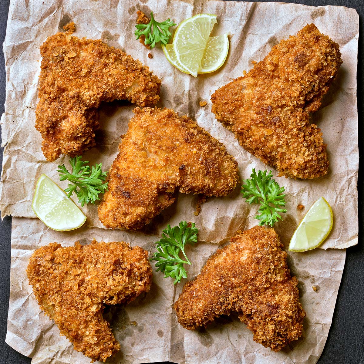 When using an oven to keep crispy chicken warm, it needs to be preheated to a temperature of 200°F. This heat level is enough to allow the steam to dissipate without turning the star of the show soggy. 
