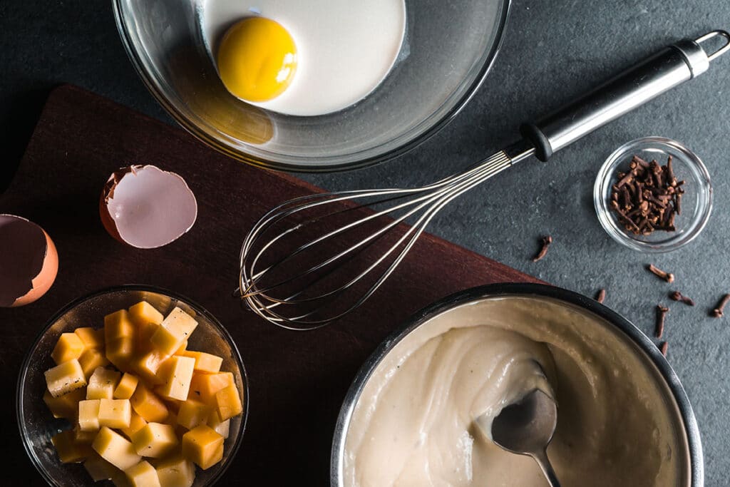 Cooking the sauce on too high a heat could be the problem, especially if you are using a dairy-based cheese, as most people do. If the heat is too high, the protein and the cheese’s water can separate, with the protein turning into curds.