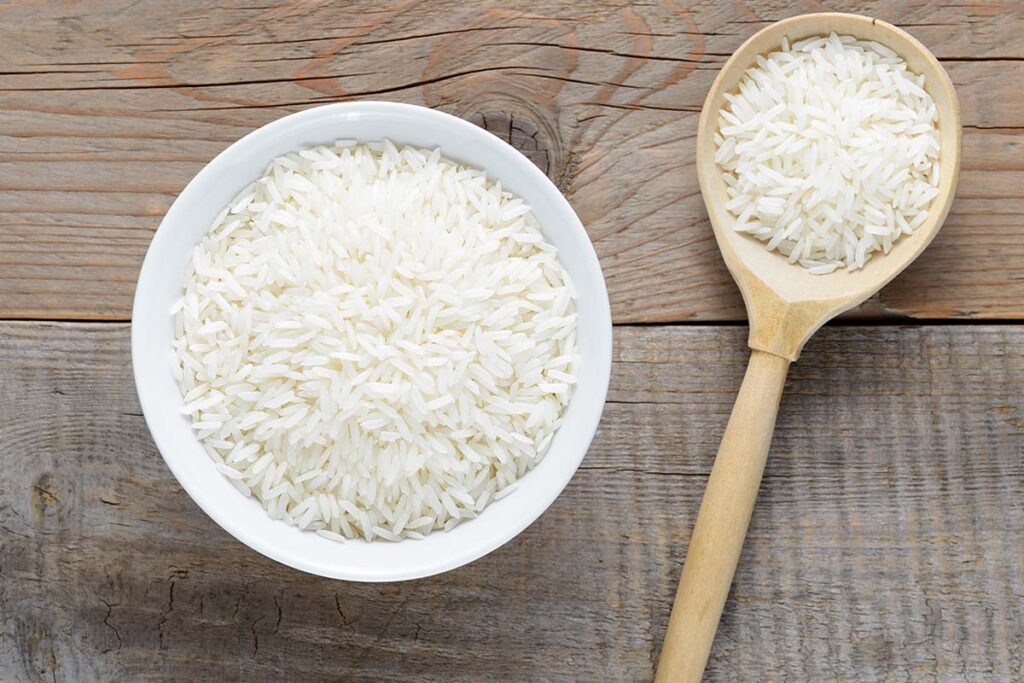Don’t use short grain, glutinous, sweet sushi rice. Use medium grain jasmine rice. It’s much sturdier and produces a bowl of fluffier rice that won’t clump together when you fry it.