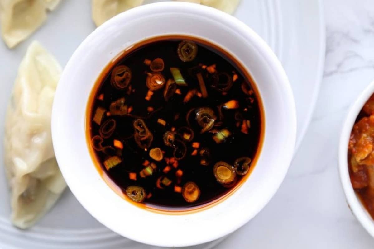 Dumpling dipping sauce - Ingredients-wise all you need is some minced garlic, rice wine vinegar, sesame oil, soy sauce, and a smidgen of hot chili. Experiment with the blend and make it your own.