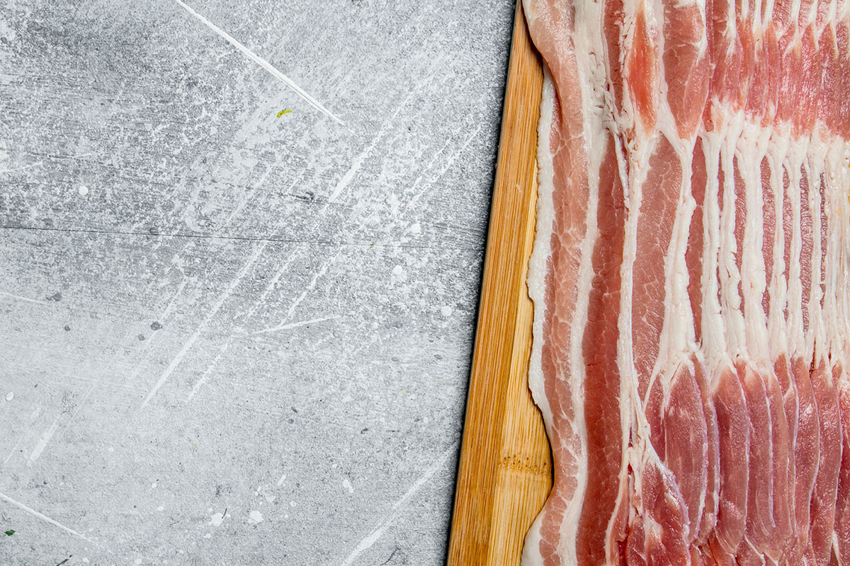 Streaky or side bacon is the bacon you find in most stores. It's called streaky bacon because it has long fat layers running parallel to the rind. It is from the animal's fattier belly and comprises of 1:3 parts meat to fat. 