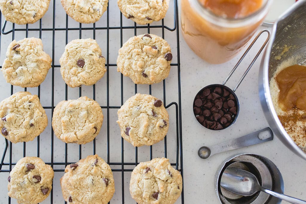 Promptly move and arrange the cookies into a cooling rack and let them sit until they cooled down. Do not allow them to rest in the hot baking sheet as they will continue cooking, consequently losing the moisture.