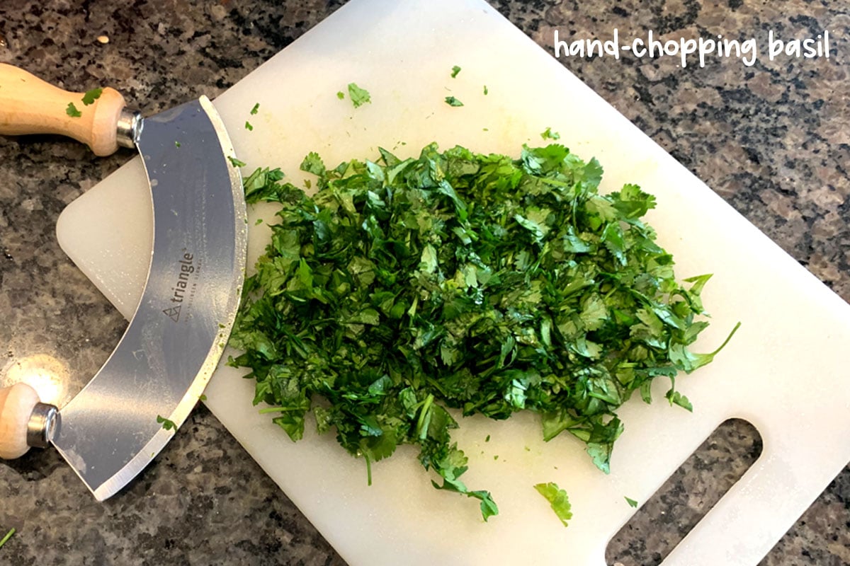 A sharp knife is crucial to avoid bruising or tearing the basil leaves. Whenever you chop basil, make sure the edges are sharp.