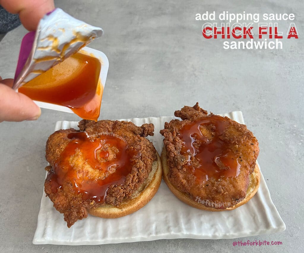Transfer the warmed chicken fillet onto the bottom half of the warmed bun, apply some Chick Fil A sauce. Serve and enjoy.