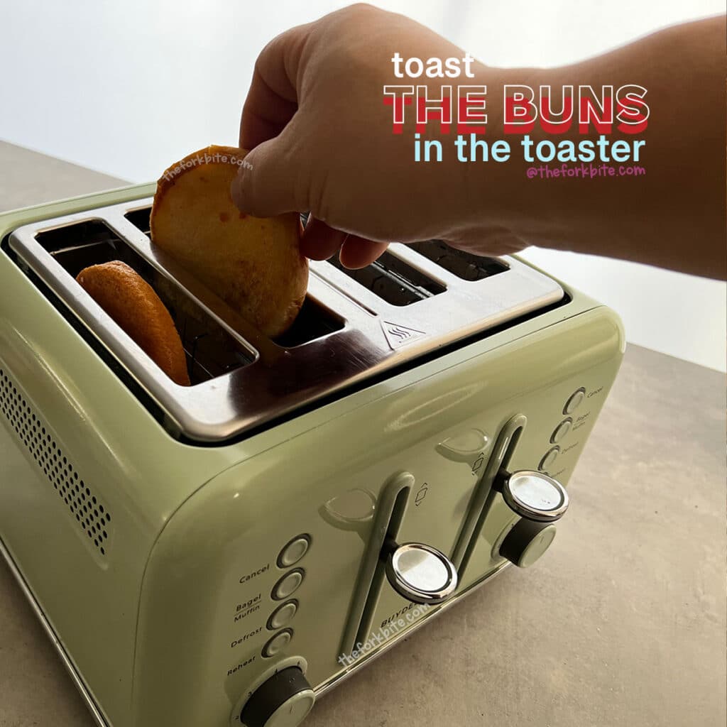 Rather than warming the buns in the oven, you could toast them in your toaster for one minute.