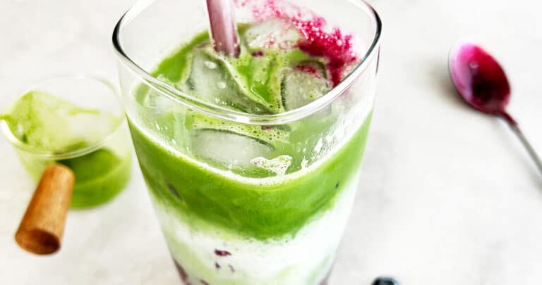 This Iced Blueberry Matcha Latte is a sweet and creamy drink that you can make in under 1 minute for less than one dollar! It's perfect for an afternoon pick me up or beat the summer heat.