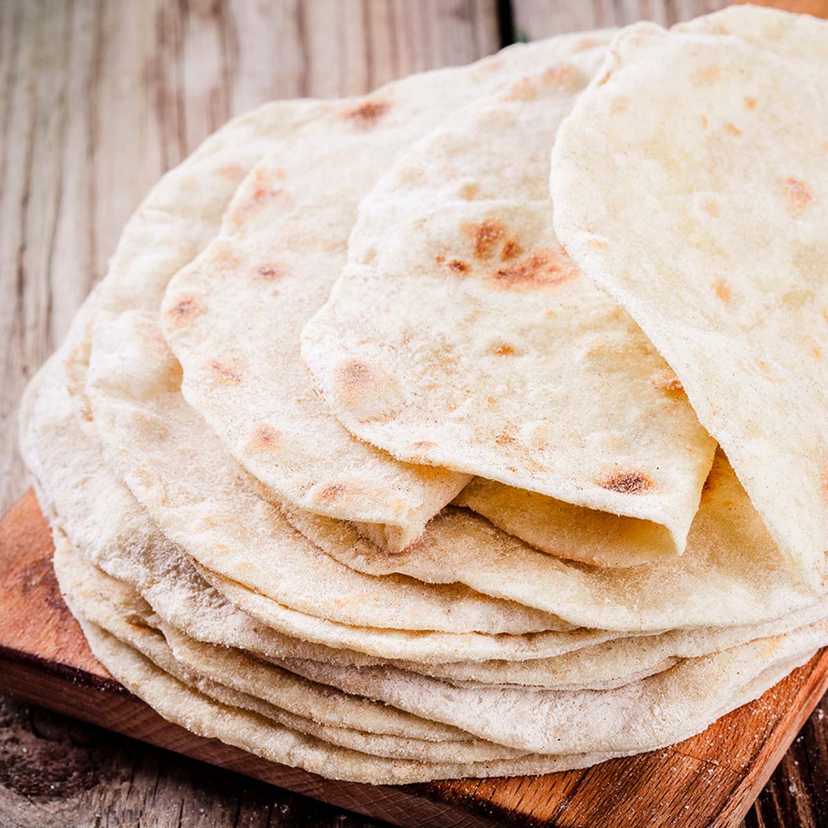 The key ingredients are wheat flour, water, salt, oil, and baking powder. They're typically soft and pliable, making them a popular choice for tacos.