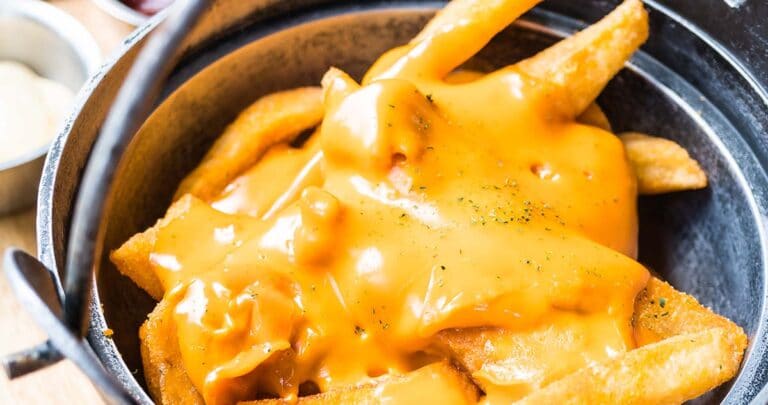 These copycat Wingstop cheese fries are just like the ones you love from Wingstop, but they're much easier (and cheaper) to make at home.
