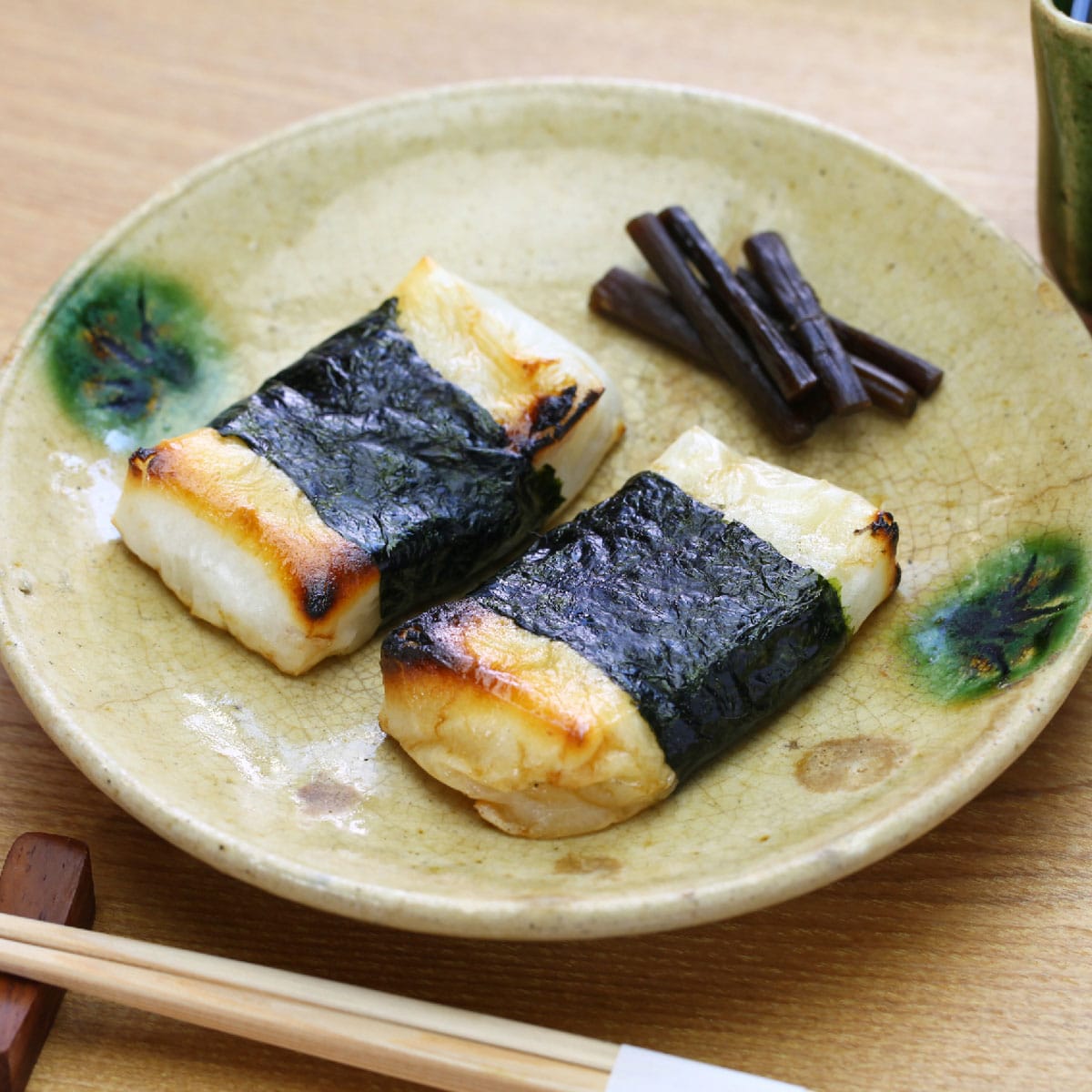 What is Isobeyaki mochi? The outside of this type of mochi is coated with soy sauce and sugar and wrapped with nori seaweed.