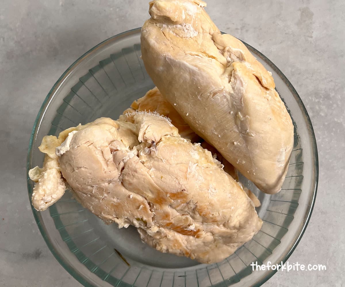 Cut the chicken into small, manageable pieces. Too large a chicken will be hard to shred evenly. By doing this, the chicken will be less likely to damage the blades.