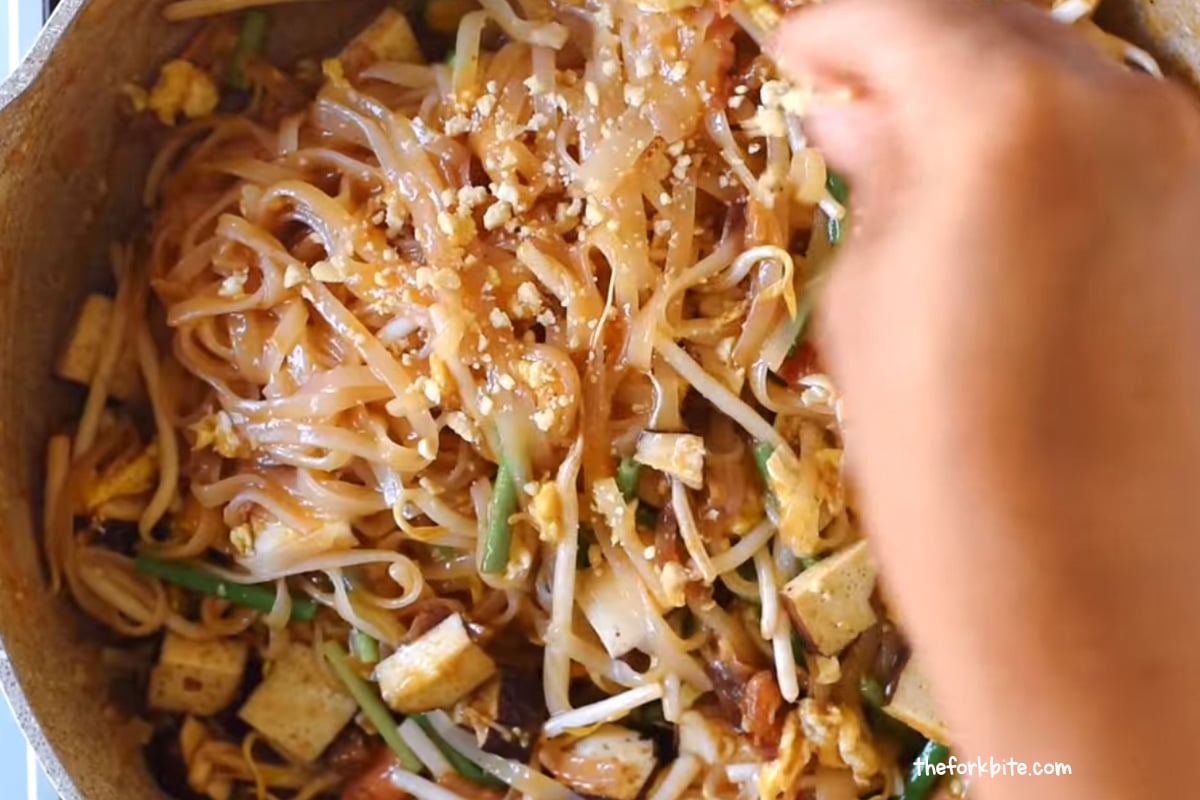 Sprinkle the crushed peanuts over the noodles and give them a light toss to combine. Serve immediately and enjoy! Peanuts add texture, crunch, and nutty flavors to the dish, making it a complete meal.