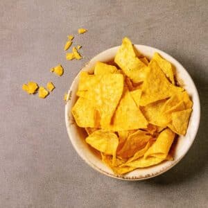 Heating up tortilla chips at home is a great way to take your snacks to the next level. You can easily make store-bought chips tastier and more flavorful with just a few simple steps. All that's left is to enjoy!