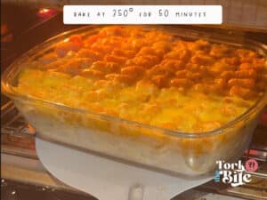 Cook the tater tots casserole at 350°F for 50 minutes to achieve a hot, bubbly casserole with melted cheese and crispy, light brown tater tots.