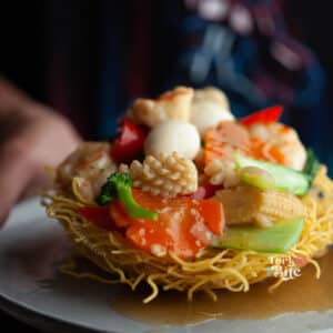 Indulge in the authentic flavors of Vietnam with this delicious Mi Xao Gion recipe. Savor the perfect blend of savory noodles, juicy stir-fried meats, and vegetables, all cooked perfectly with a rich sauce.