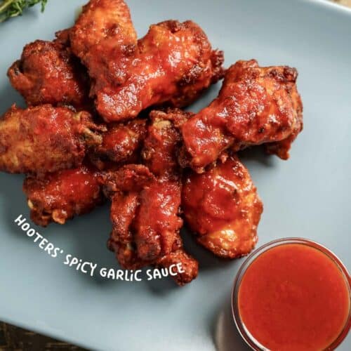 Discover the secret to Hooters' famous Spicy Garlic Sauce recipe! Learn how to make this mouth-watering, tangy sauce at home in just a few easy steps. Perfect for wings, dips, and more!