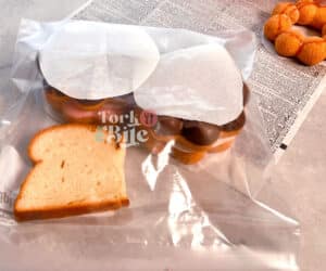 You can also place a piece of bread in the container with the donuts. This will help to keep them from getting stale or hard, as the bread will absorb any moisture that creeps into the container.