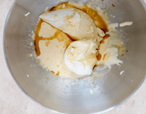 Butter and mascarpone cheese blending smoothly in a stand mixer for Tiramisu Cupcakes recipe.