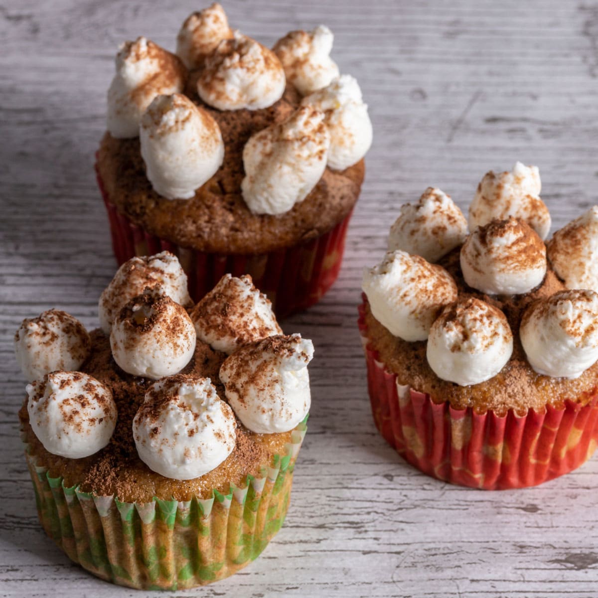 Delicious Tiramisu Cupcakes with cocoa dust finish and amaretto mascarpone frosting.