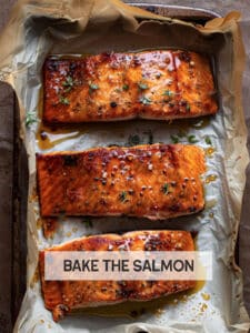 Close-up of perfectly cooked honey glazed salmon fillet with a golden-brown glaze, flakes easily with a fork.