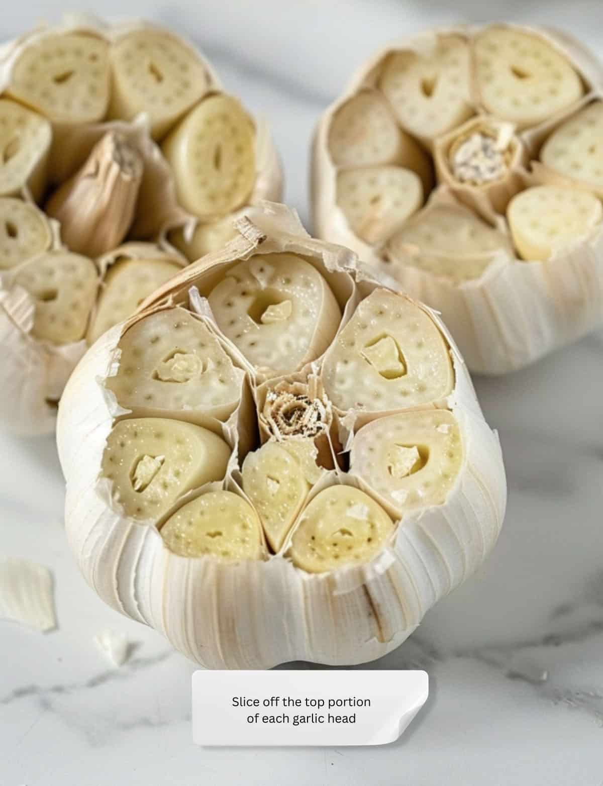 Sliced garlic heads with exposed cloves ready for roasting.