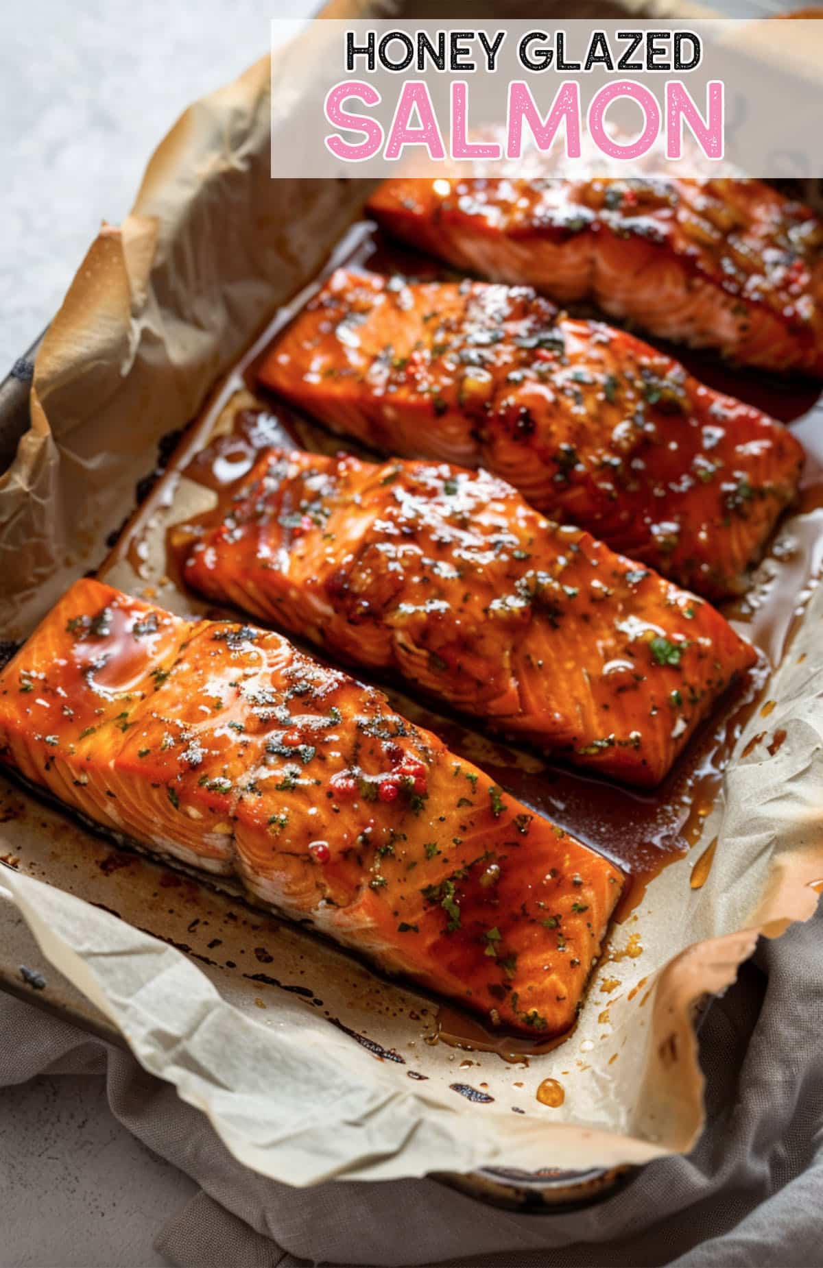 Close-up of baked honey glazed salmon fillet, glistening with a sweet and savory glaze