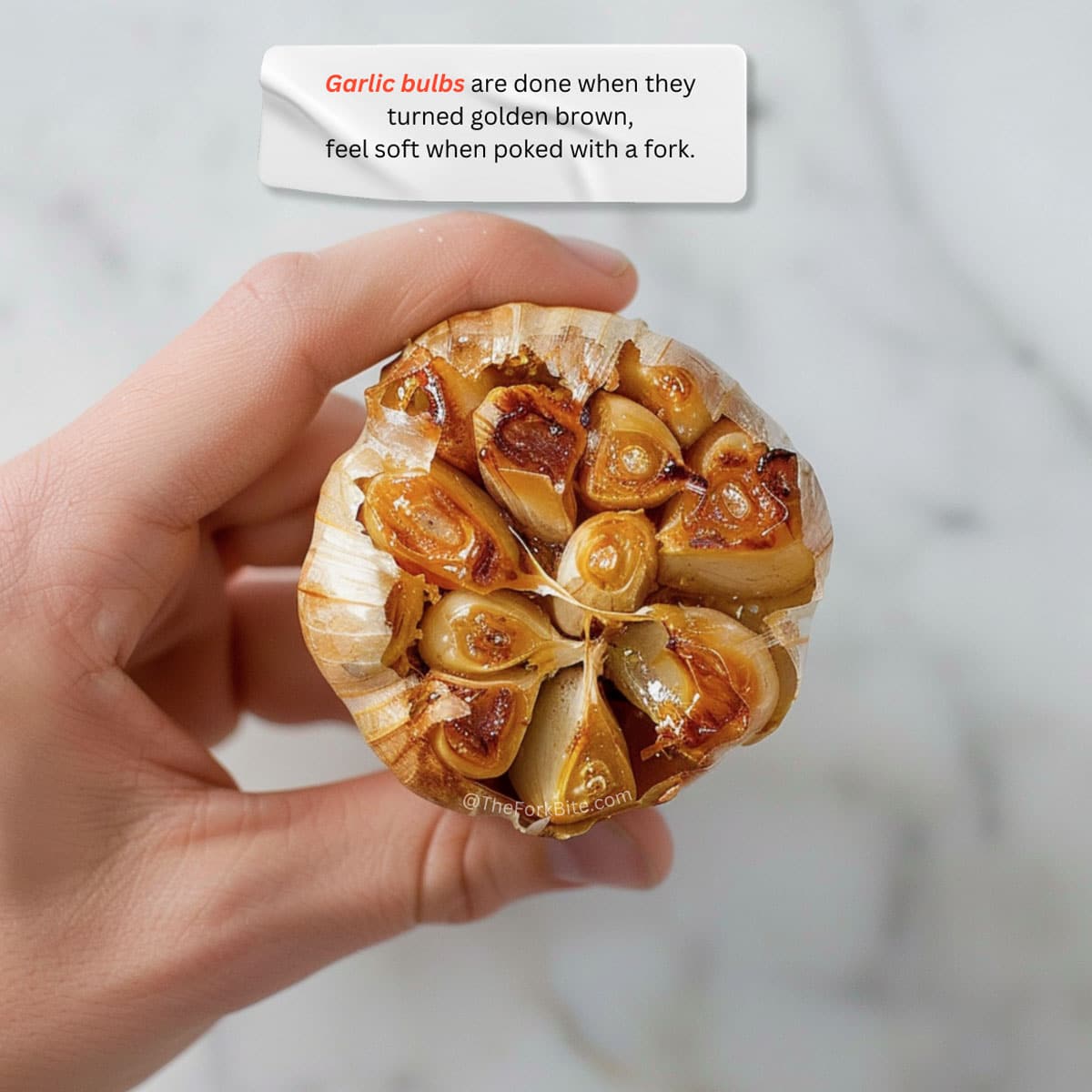 Close-up of roasted garlic cloves with golden-brown color and creamy texture.