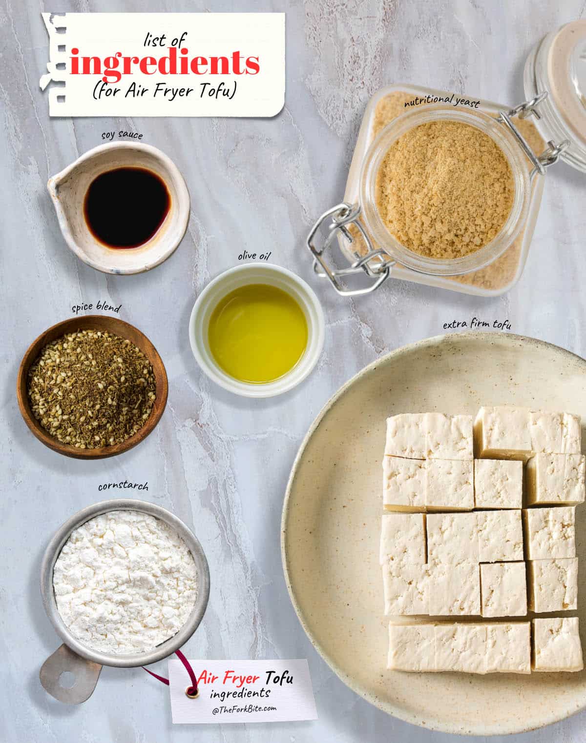 Air Fryer Tofu Ingredients: Extra-firm tofu, cornstarch, nutritional yeast, soy sauce, oil, and spices. Easy prep for a delicious and healthy snack or meal.