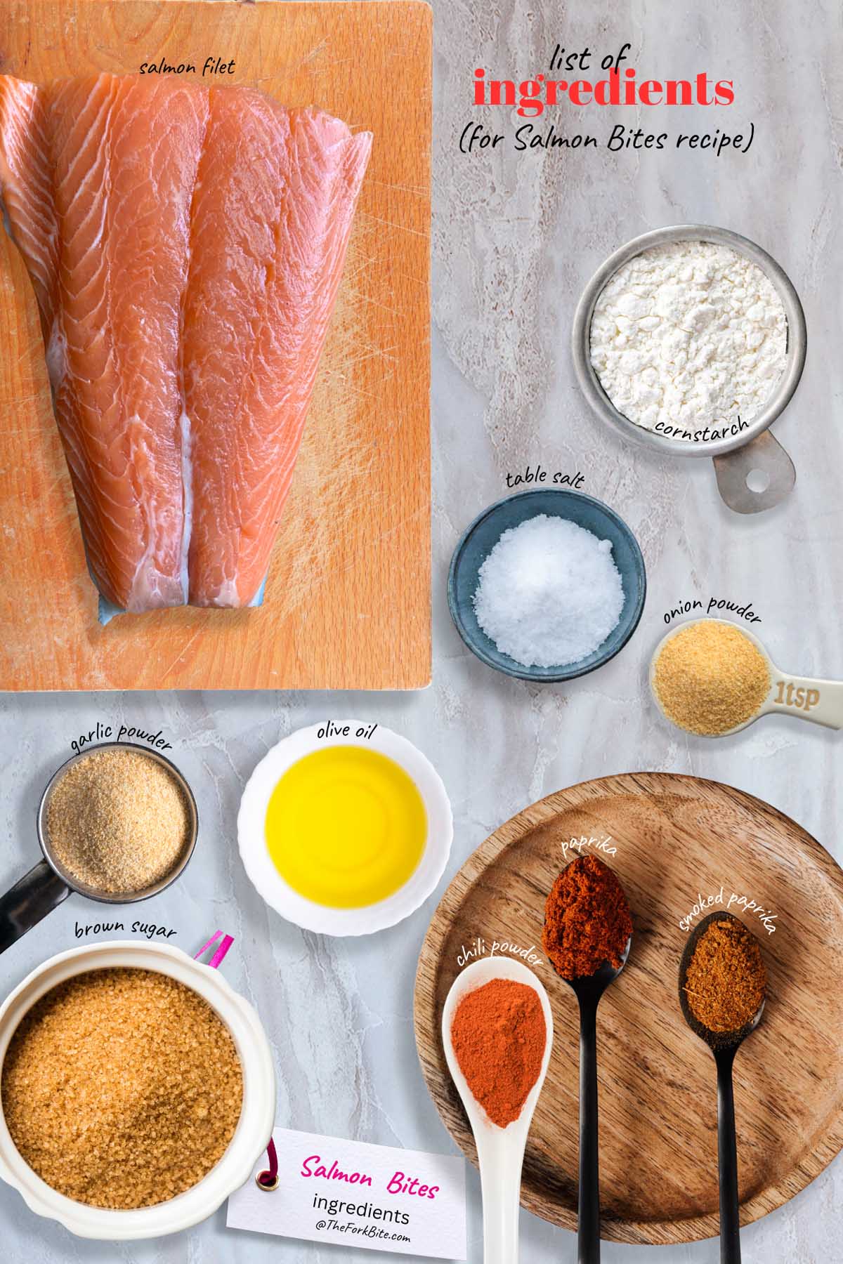 Close-up of raw salmon filet with all the ingredients like spices and olive oil, ready to be cooked into crispy air fryer salmon bites