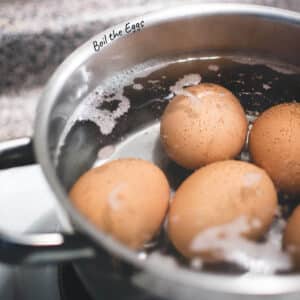 Pot of eggs with enough water for even cooking, ready to be boiled on the stove.