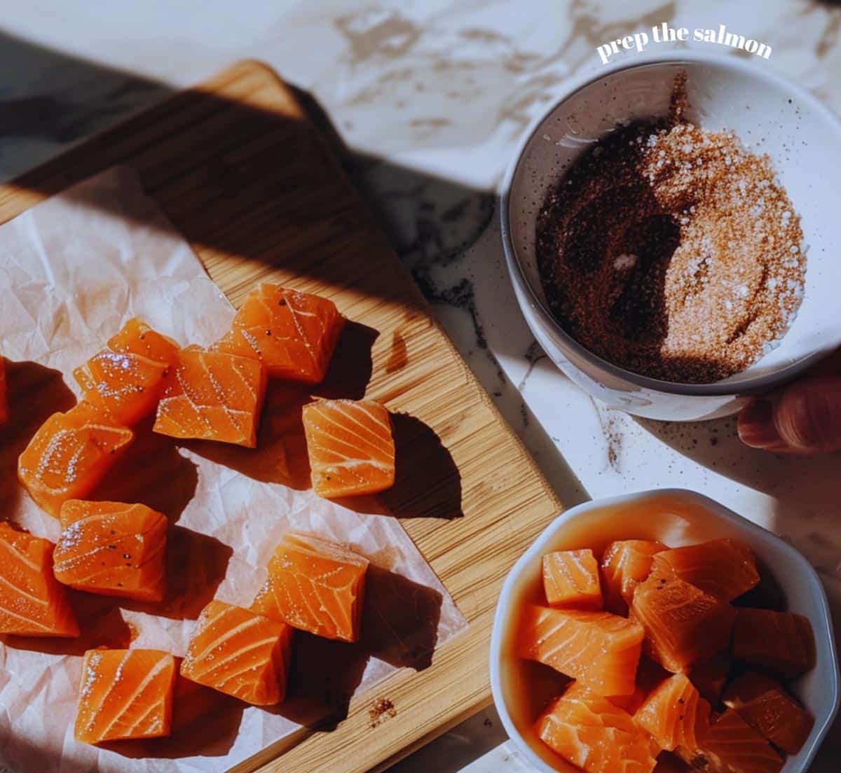 Salmon cubes ready for the air fryer, with skin removed and patted dry for optimal crispness.