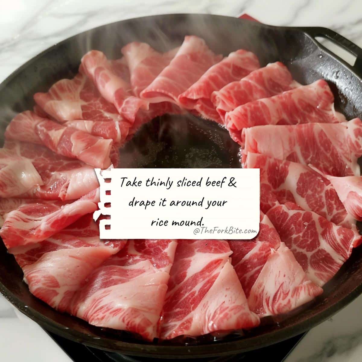 Raw beef sizzling on a hot pan for Pepper Lunch recipe