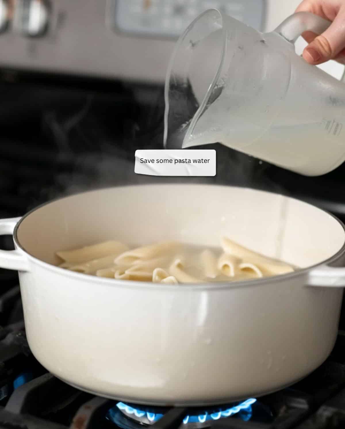 A jug scooping cloudy pasta water out of a pot, emphasizing its transformed state and sauce-enhancing properties.